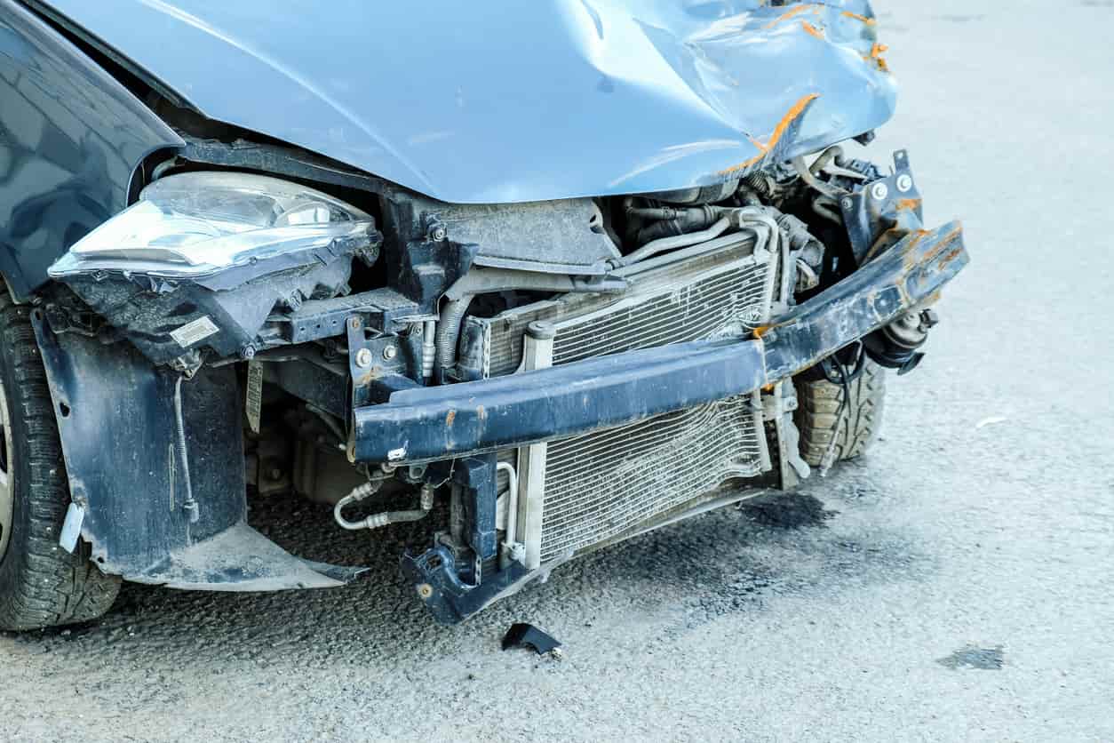 Car accident scene with damaged vehicles on the road